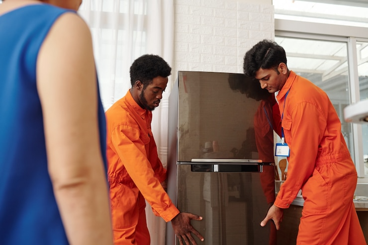 movers-orange-uniform-carrying-n
